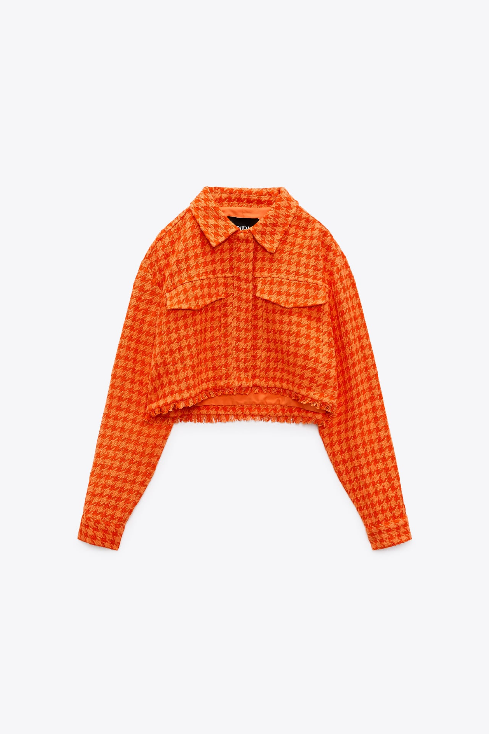 https://flyfiercefab.com/wp-content/uploads/2022/03/Zara-orange-houndtooth-tweed-cropped-jacket.png