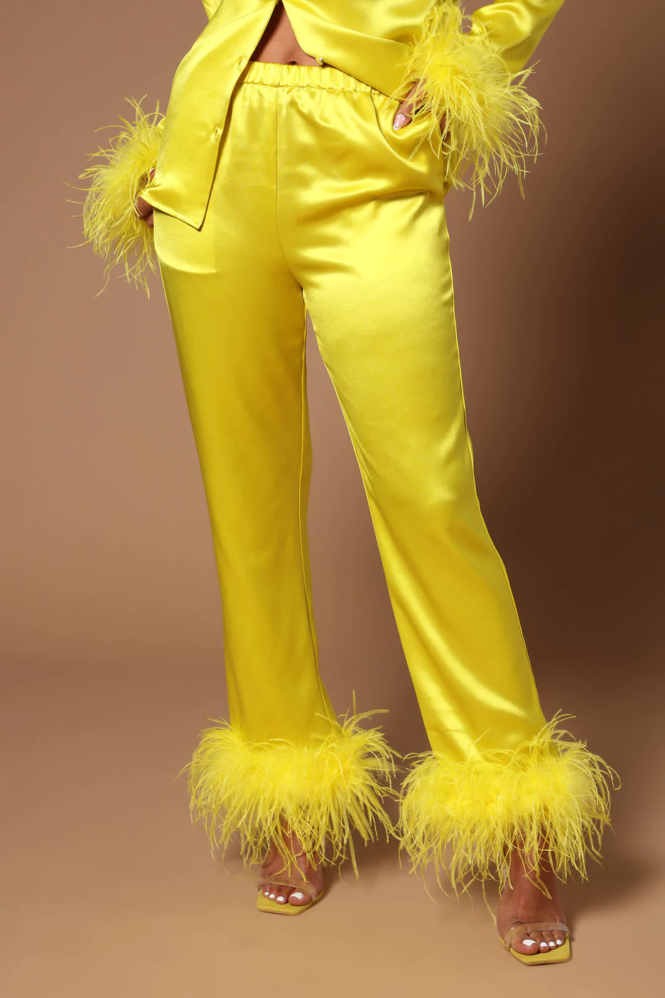 https://flyfiercefab.com/wp-content/uploads/2022/10/Fashion-Nova-Yellow-Satin-Feather-Trim-Pants.png
