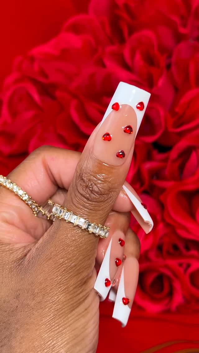 Girl, cancel that nail appointment. Let me show you how to do these super easy Valentine’s Day nails at home! ❤️💅🏾🌹✨ Comment “SHOP” and I’ll DM you the links to everything you need to make these press on nails at home! 💌 https://liketk.it/5ORF0 

products used:

💅🏾 XL BROWN BASE FRENCH TIP NAILS | @btartboxnails 
💅🏾 RED HEART RHINESTONES | @amazonbeauty 
💅🏾 BUILDER GEL | BTArtBox 
💅🏾 TOP COAT | @gaoy_official_ 
💅🏾 NAIL DEHYDRATOR | @apresnailofficial 
💅🏾 NAIL PRIMER | apres nail
💅🏾 NAIL GLUE | BTArtBox 
__

#flyfiercefab #nailinspo #valentinesday valentines day nails, press on nails, nails at home, gel nails at home, ri influencer, boston influencer, black girl style
